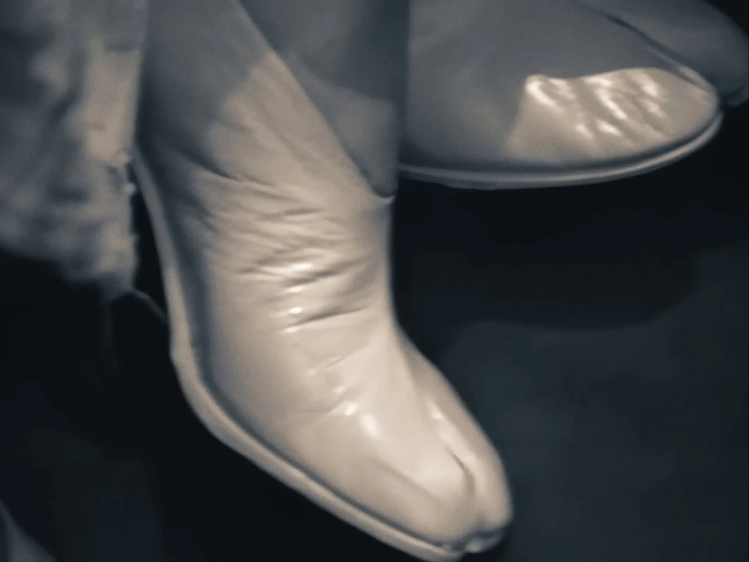 Archive footage in the house's own Tabi film: a white Tabi boot on the foot.