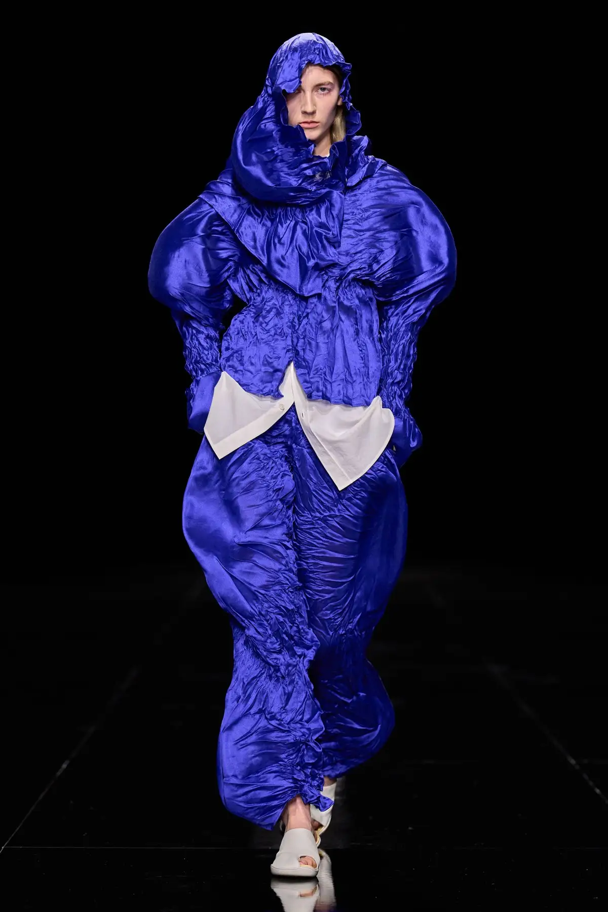 Look 24. Shiny blue cloth with round bulges, our Balloon Twist pick.