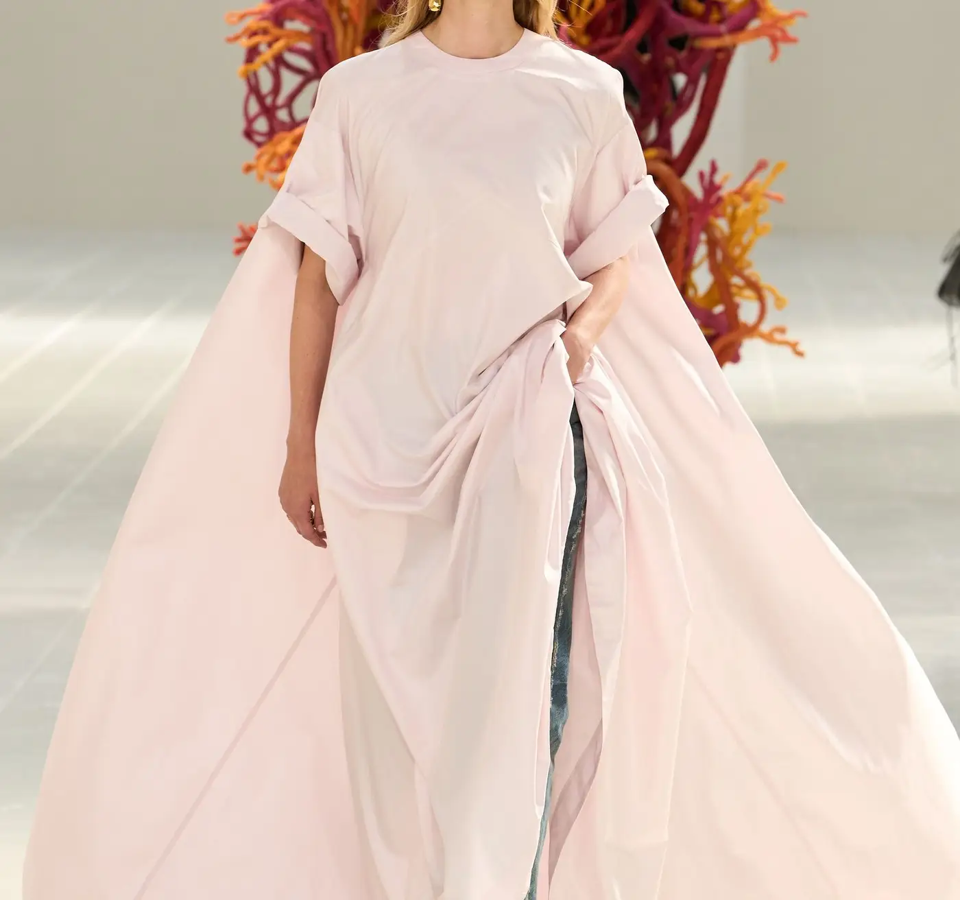 Closer. Pink volume up front; denim still visible underneath.