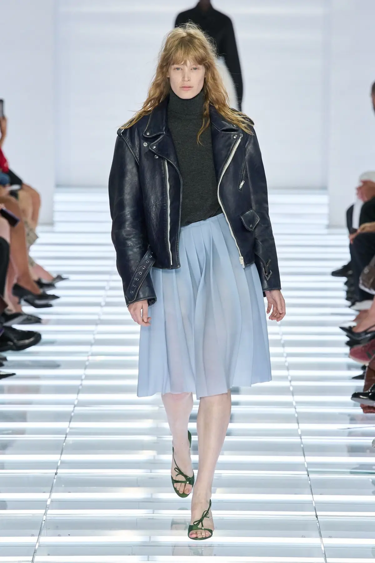Look 18. Pale blue under a black leather jacket.