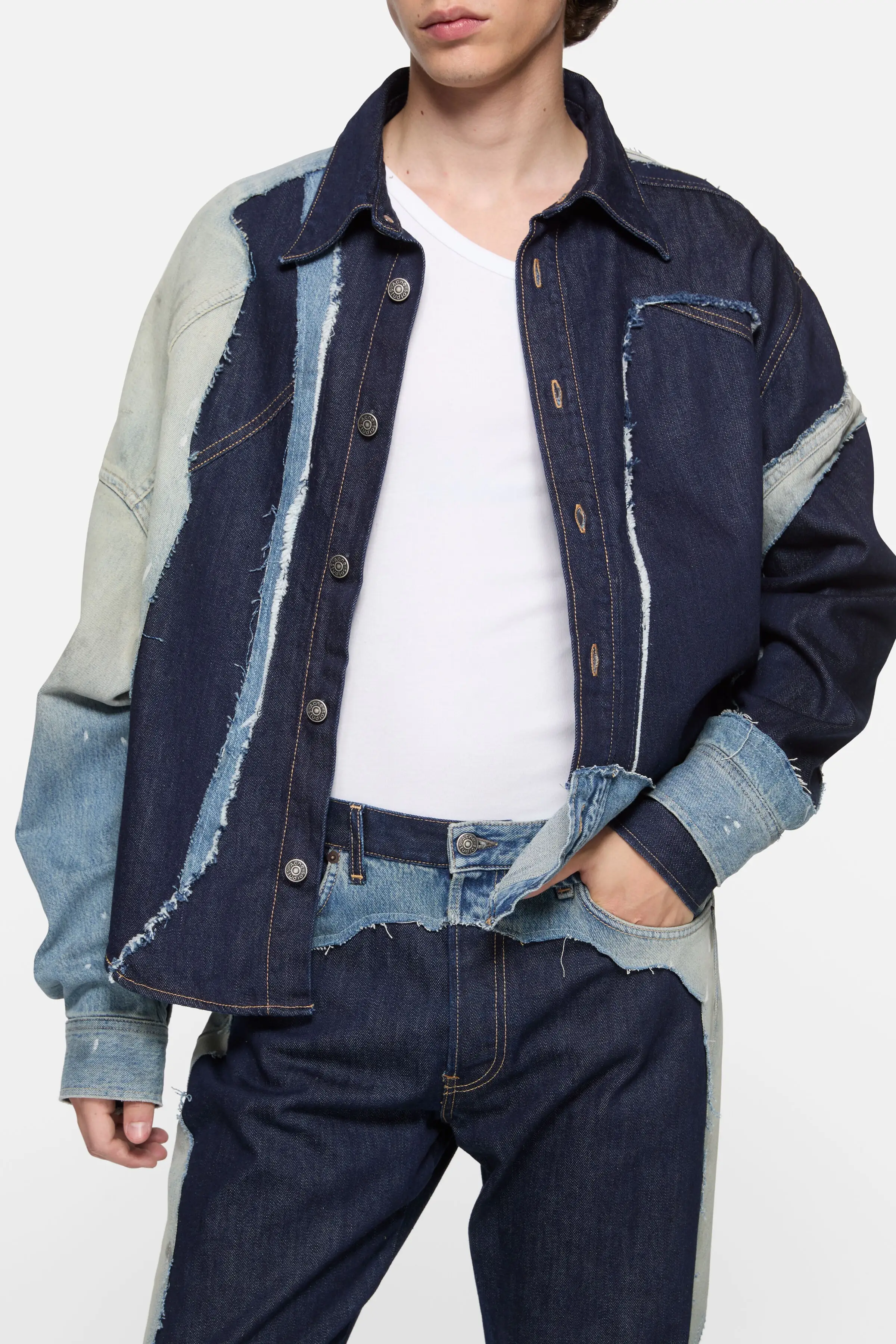Acne Studios Hussein Chalayan, Patchwork Denim Shirt. Dark indigo and faded blue panels joined with raw edges.