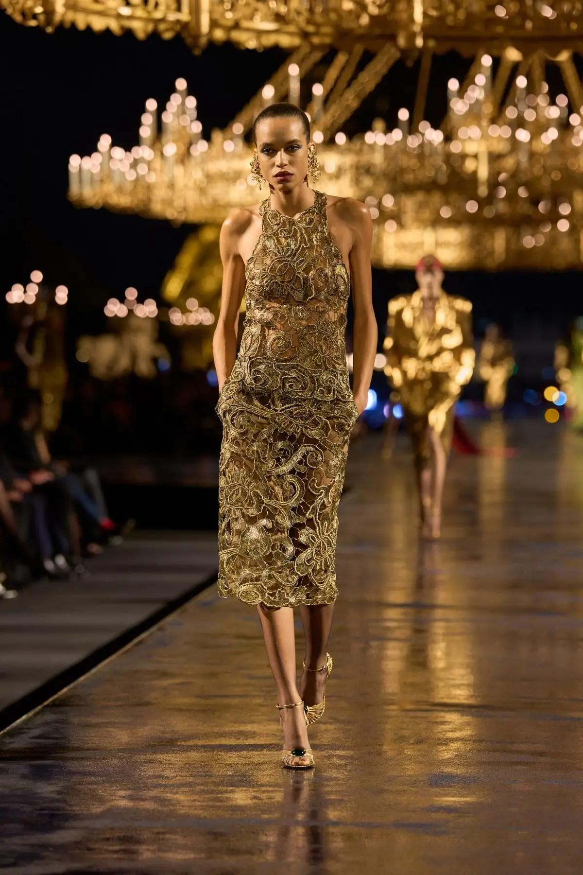 Look 14. A fitted gold dress that catches the light.